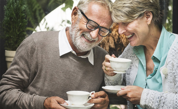 An elderly couple on a date, enjoying each others company