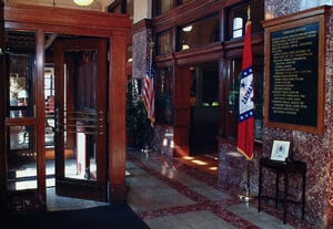 Red Vermont marble walls and chipped marble floors are used throughout the downstairs and upstairs public areas, as well as in the staircase.
